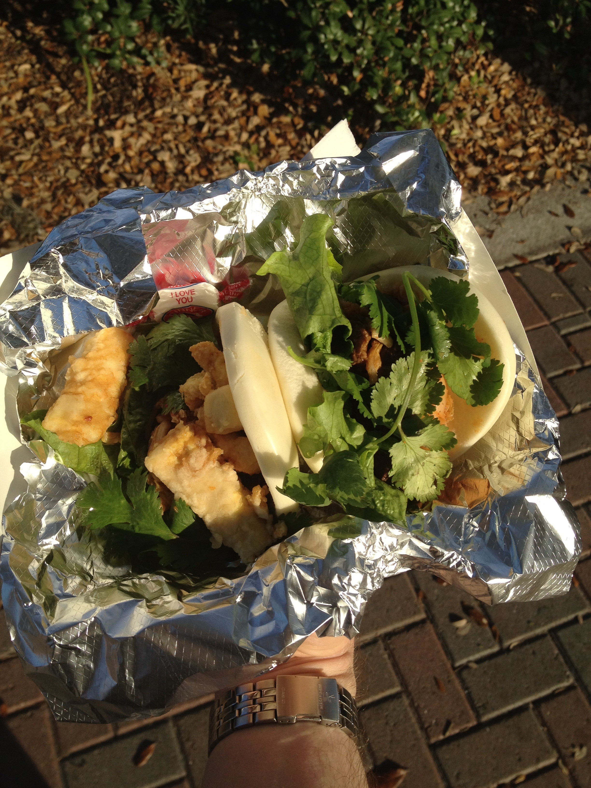 Friend tofu, left, and chili beef bun wraps from Sticky Bunz. You probably can't see it, but there's a mint that says "I love you." (Staff photo / Alan Shaw)