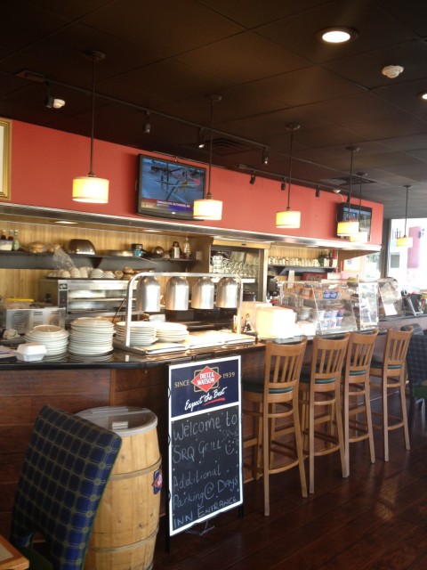 Find a table inside and sink into one of the blue-and-green upholstered chairs while watching four flat-screen TVs and partaking of free Wi-Fi.