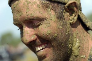 John Taylor of Arcadia says "the beer" is what compels him to get muddy at Swamp Cabbage Weekend. (STAFF PHOTO / THOMAS BENDER)