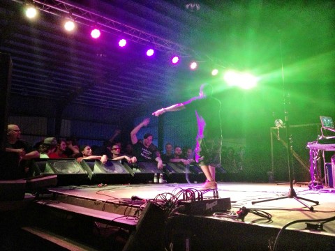 Del the Funky Homosapien under the bright lights at Flight Source International.