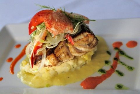 Pan seared Carolina wreckfish with herb mashed potatoes, sweat corn sauce, fennel and lobster salad is served at the Bijou Cafe in Sarasota. (H-T Archive Photo)