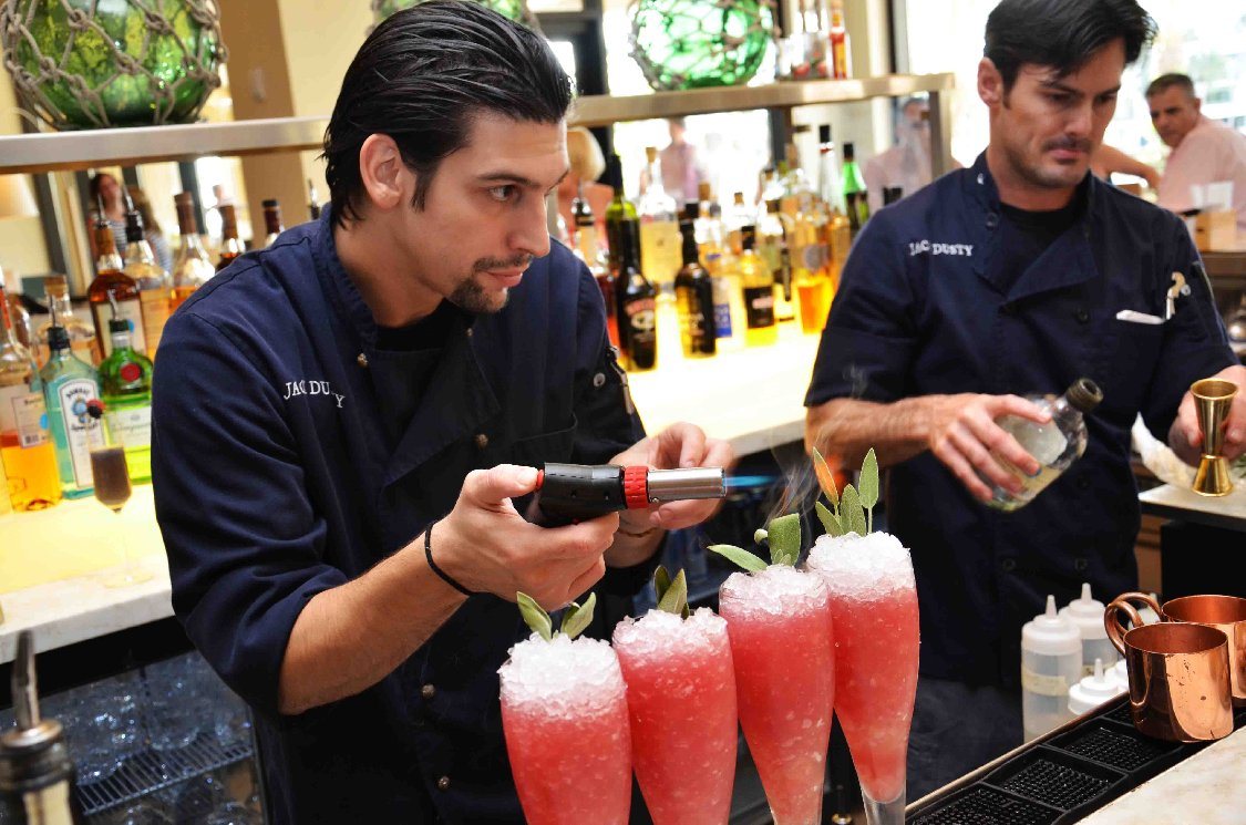 Cocktails with "flare:" Roy adds the final touches to an English Shipwreck.