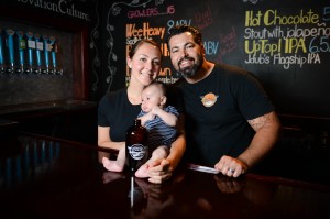 Jeremy Joerger, his wife, Kelly, and their son, Max, spend some time together at the tasting room at JDub's Brewing Co. in Sarasota. (Staff photo by Rachel S. O'Hara)