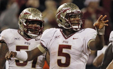 Florida State quarterback Jameis Winston (5) celebrates his touchdown run against Clemson during the second half of an NCAA college football game, Saturday, Oct. 19, 2013, in Clemson, S.C. Offensive linesman Bobby Hart is at left. (AP Photo/Mike Stewart)